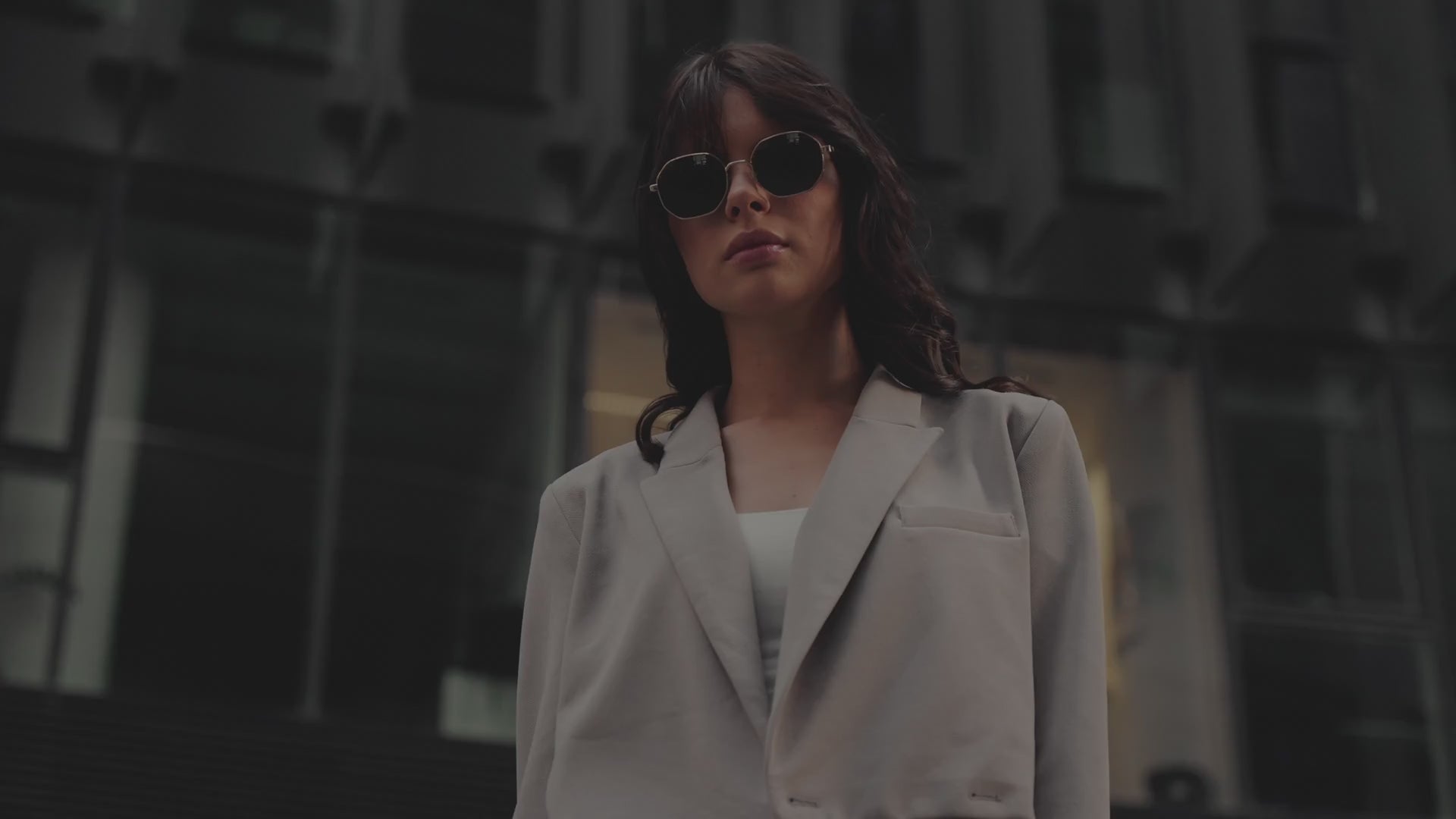 Load video: Beautiful model in the street, playing with her hair.