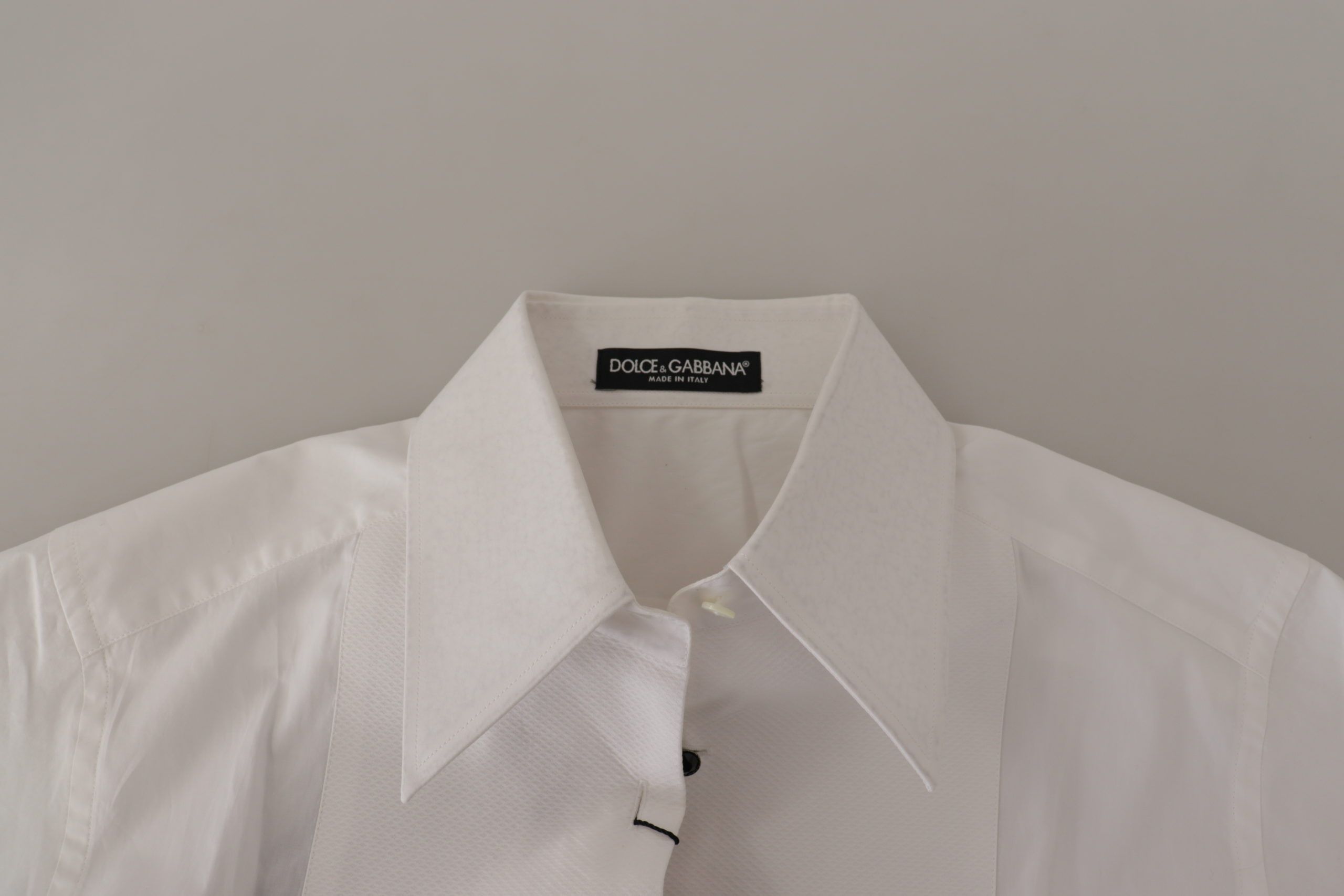 Dolce & Gabbana Elegant Sleeveless Tuxedo Blouse with Crystal Buttons - ACCEXO