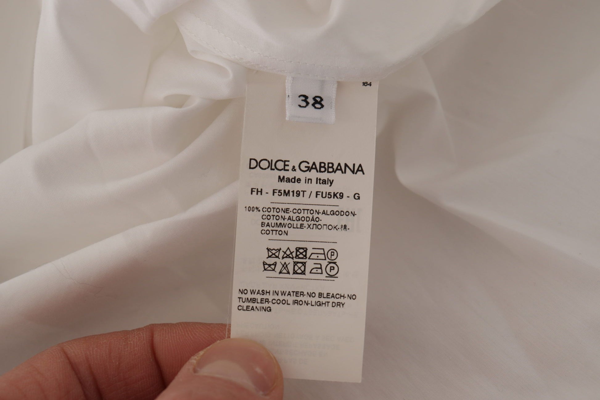 Dolce & Gabbana Elegant Sleeveless Tuxedo Blouse with Crystal Buttons - ACCEXO