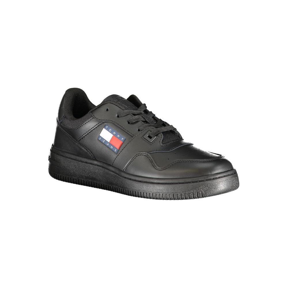 Black sneaker with a brand logo on a white background