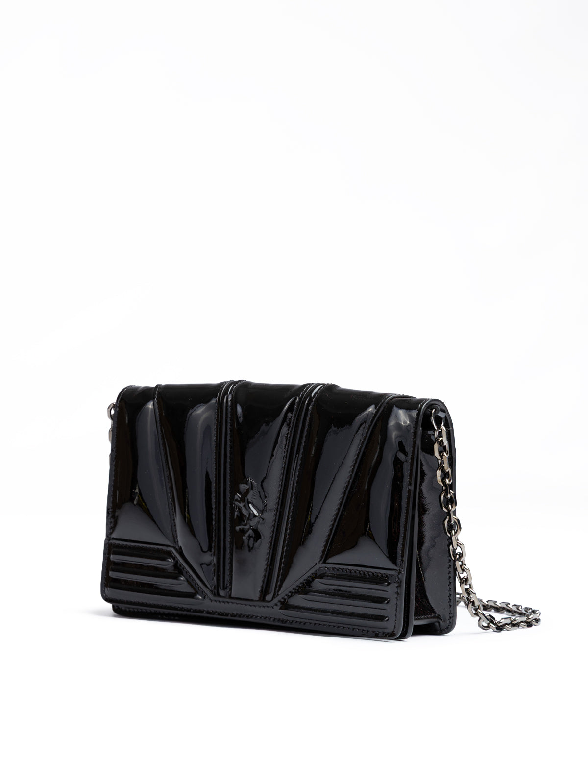 Black patent leather handbag with chain strap on a white background