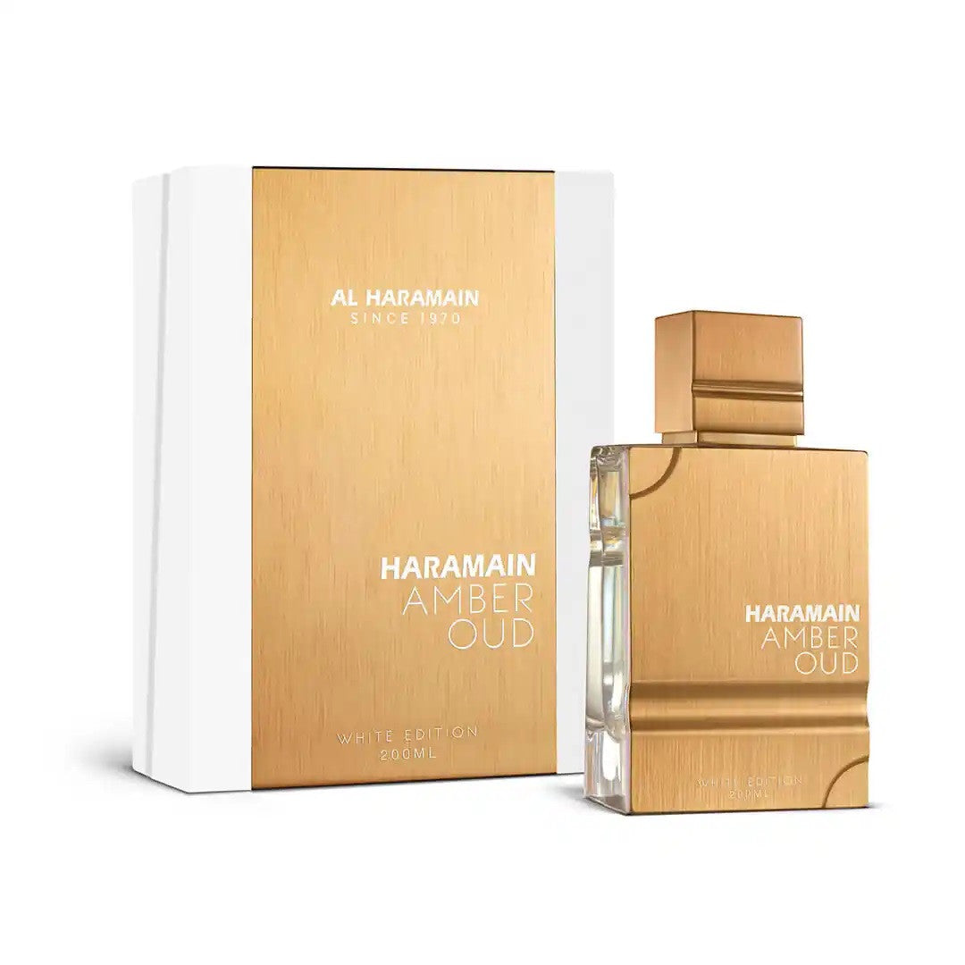 A product image featuring a white box and bottle of AL HARAMAIN Amber Oud White Edition Eau de Parfum Spray.