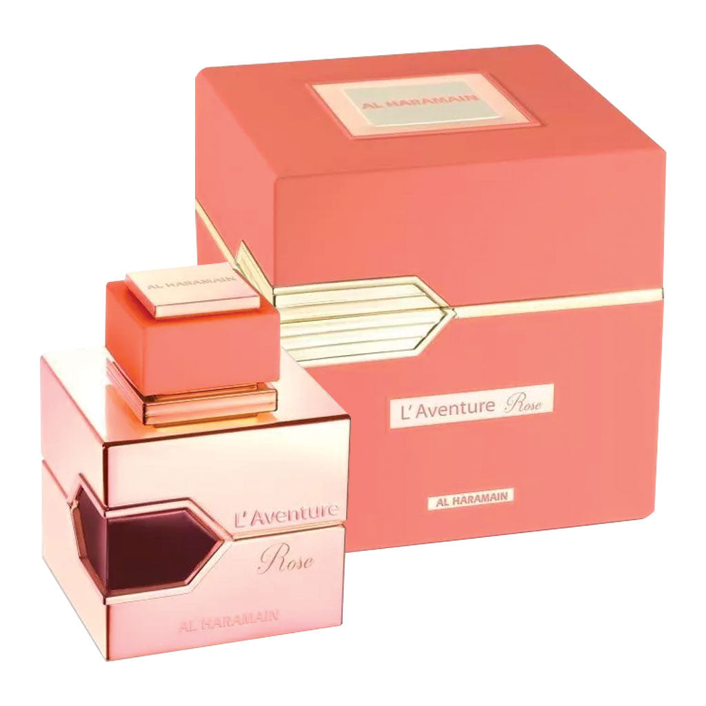 A product image featuring AL HARAMAIN L'AVENTURE ROSE 3.3 EAU DE PARFUM SPRAY for women, with the item displayed next to its pink packaging box, both bearing a gold design element.