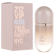 The image shows a box and spray bottle of 212 VIP ROSE eau de parfum for women by Carolina Herrera. The box is pink with the product name and the phrase 'This is a private party! NYC' printed on it.