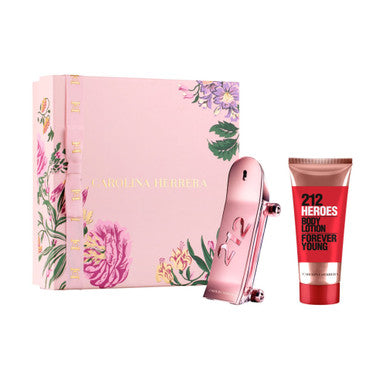 A set of CAROLINA HERRERA 212 HEROES FOREVER YOUNG cosmetics, including a pink bottle of eau de parfum spray and a red tube of body lotion, with packaging displaying floral designs.