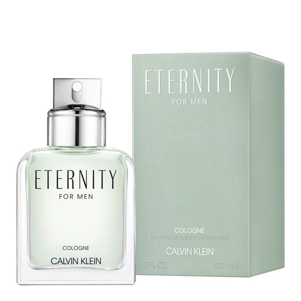 A bottle of ETERNITY cologne for men by Calvin Klein, accompanied by its green box packaging. The cologne bottle is transparent, revealing a light-colored liquid, with a silver cap.