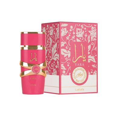 A product image featuring LATTAFA YARA CANDY 3.4 EAU DE PARFUM SPRAY for women, with the perfume bottle in a vibrant pink color and the box displaying floral patterns.