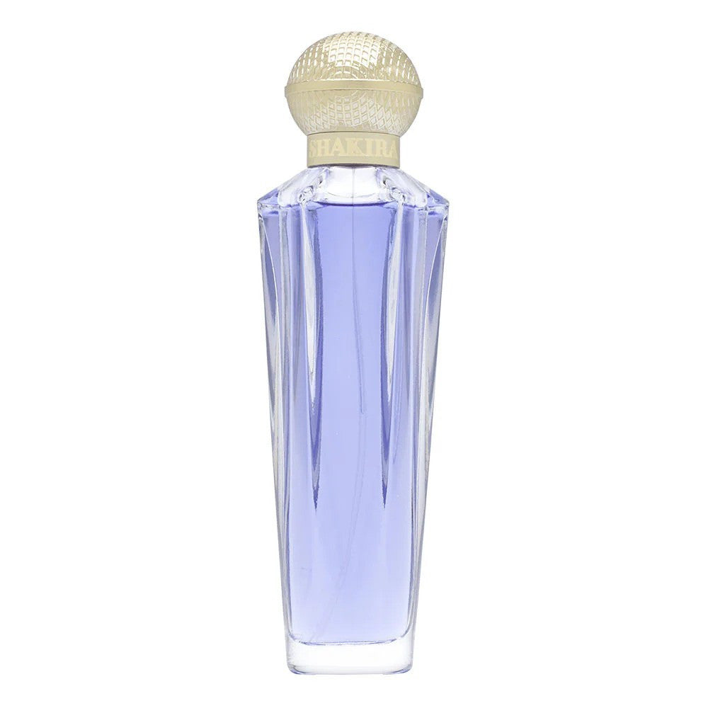 A clear glass spray bottle of SHAKIRA DREAM TESTER 2.7 EAU DE TOILETTE for women, with visible purple liquid inside and a golden cap.