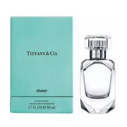 Tiffany & Co. Sheer eau de toilette spray bottle next to its blue box packaging.