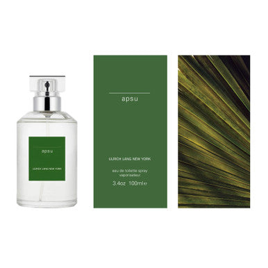 A product image featuring a bottle of ULRICH LANG APSU Eau de Toilette spray with a green label, alongside a green box and a close-up of a green leaf.