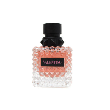 A spray bottle of VALENTINO DONNA BORN IN ROMA eau de parfum, with a clear, textured design and a black cap