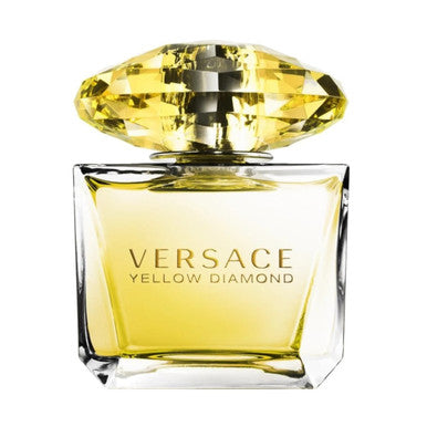 A glass bottle of VERSACE YELLOW DIAMOND perfume with a yellow cap and clear label.