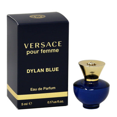 A Versace Dylan Blue Eau de Parfum mini bottle for women alongside its black box with gold accents. The box has the text 'VERSACE pour femme' and the fragrance name 'DYLAN BLUE' on it.