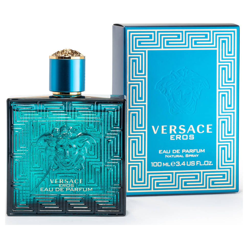 A product image featuring a VERSACE EROS Eau de Parfum spray bottle for men next to its packaging box. The bottle is turquoise with a gold cap, and the box is blue with Greek key design.