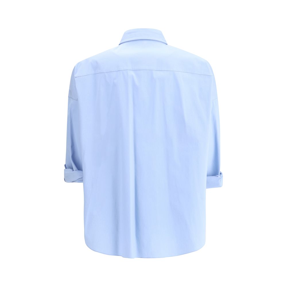 Light blue Brunello Cucinelli shiny monili shirt showcasing elegant style and quality