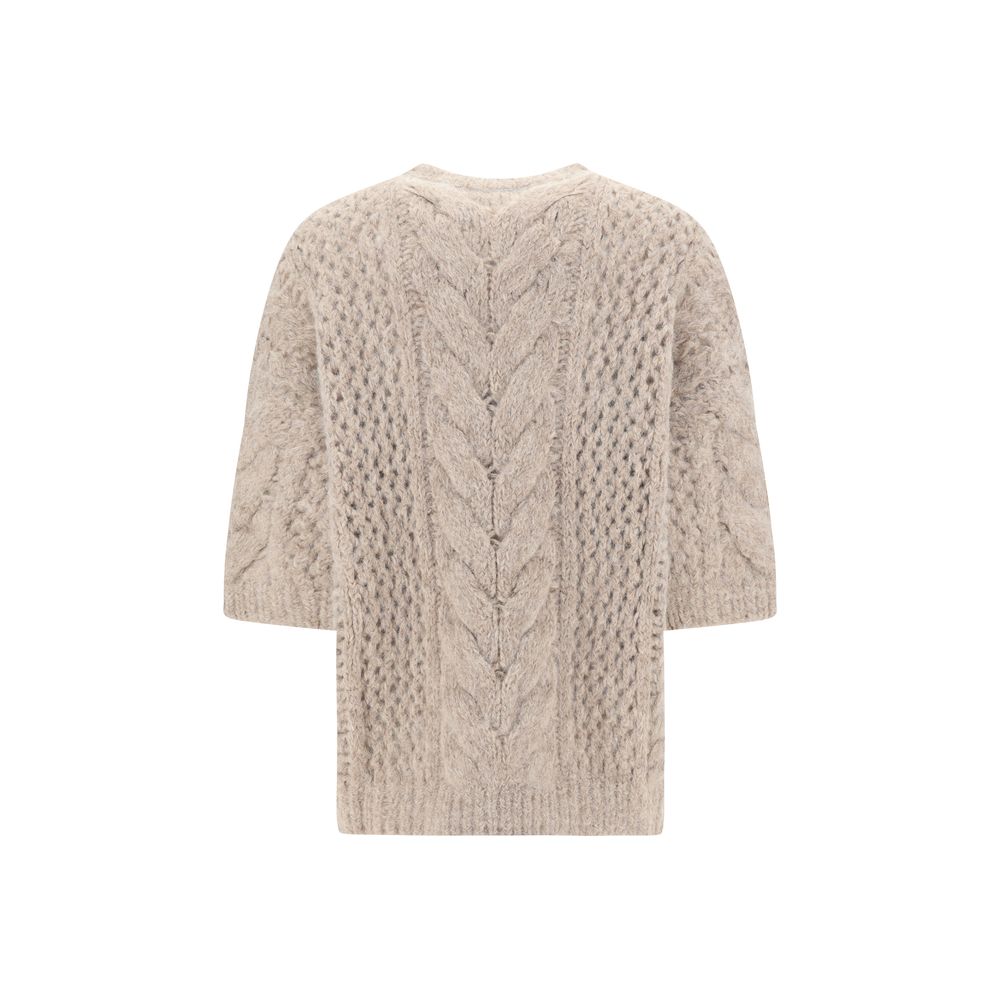 Beige cable-knit Brunello Cucinelli sweater showcasing elegant cozy style