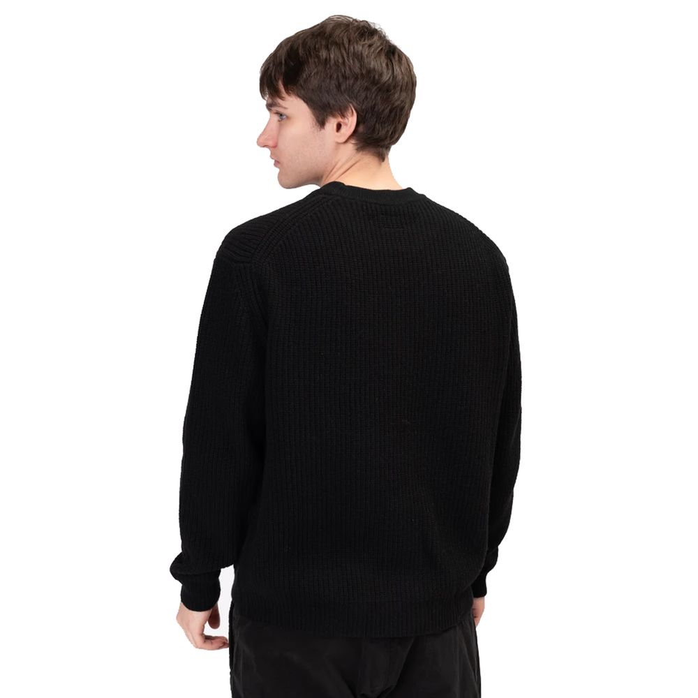 C.P. Company black wool sweater featuring a stylish ribbed texture for warmth and comfort
