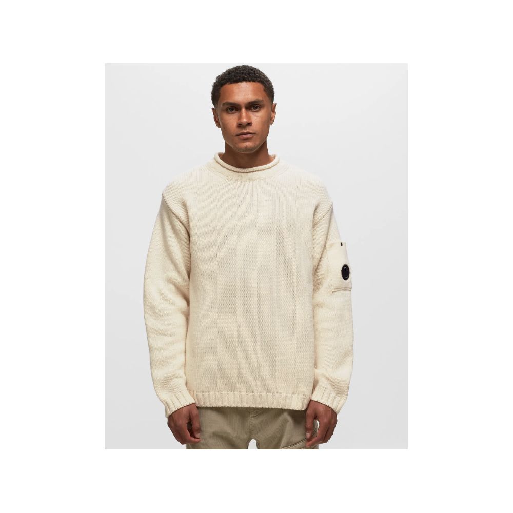 Man wearing a cream-colored knit sweater from C.P. Company White Wool Sweater collection