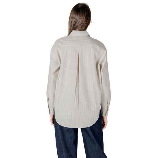 Woman’s beige button-down shirt featured in Calvin Klein Jeans Beige Cotton Sweater