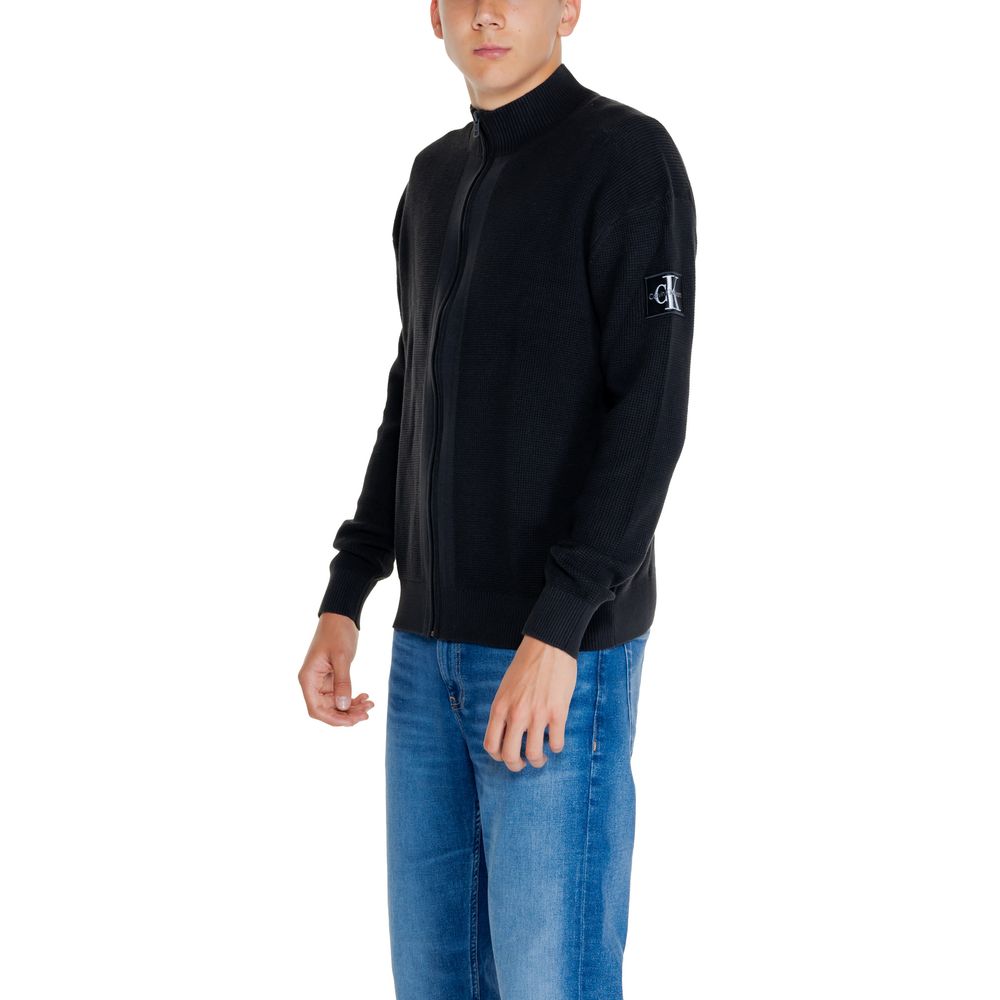 Black Cotton Rigenerato Cardigan by Calvin Klein Jeans paired with blue jeans