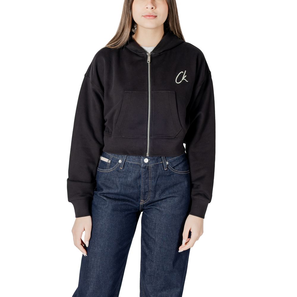 Woman wearing Calvin Klein Jeans black zip-up hoodie, a stylish black cotton sweater