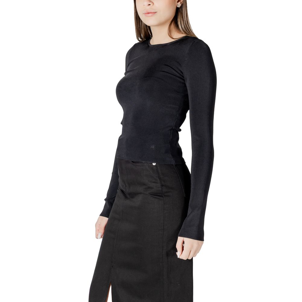 Woman’s black long-sleeved top and skirt from Calvin Klein Jeans Black Rayon Tops