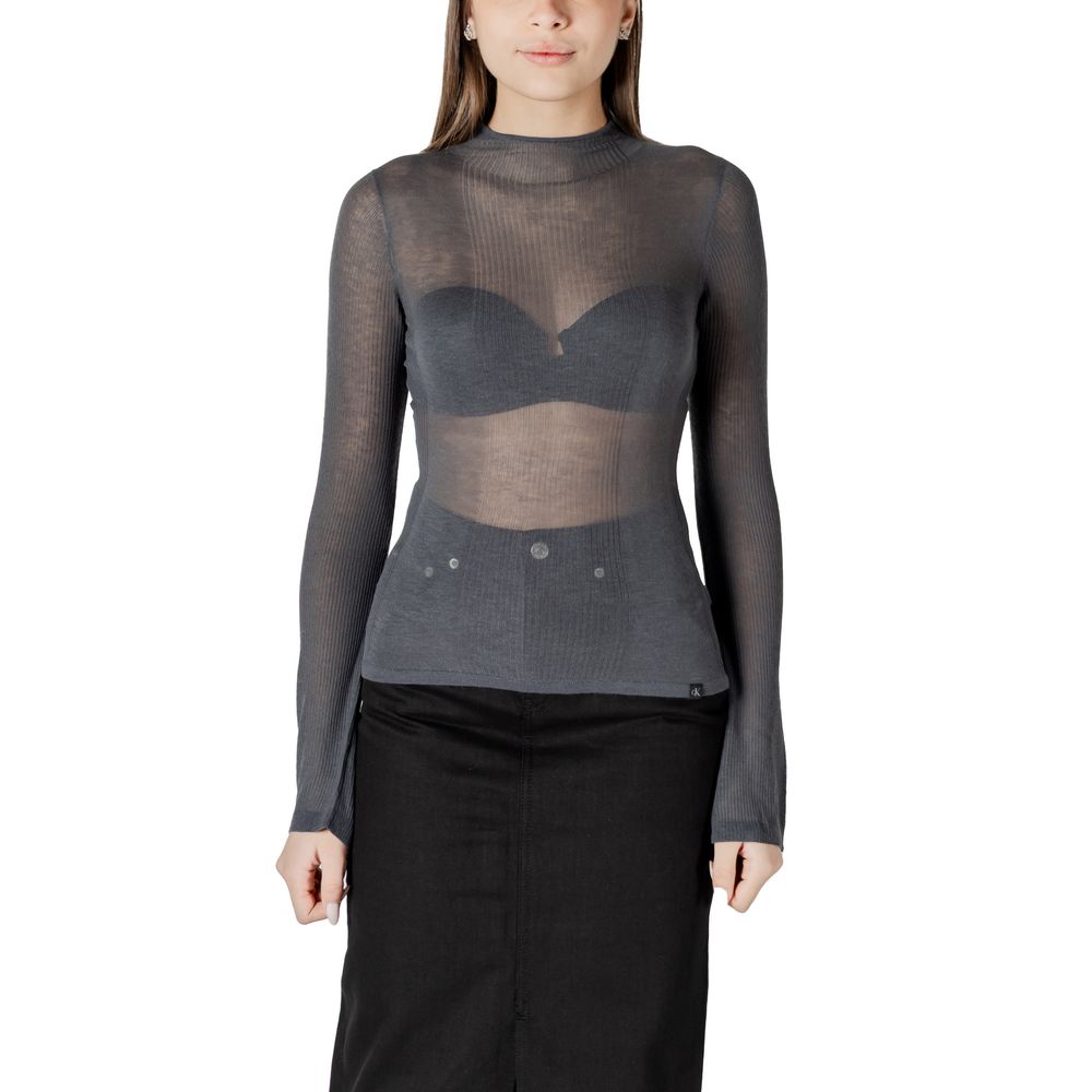 Woman in a sheer gray top from Calvin Klein Jeans Gray Acrylic Tops collection