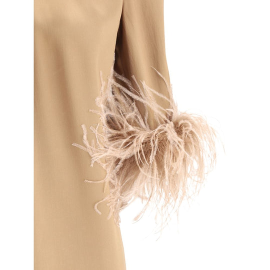 Beige Gabbana feathers blouse featuring elegant feathered cuffs for a stylish look