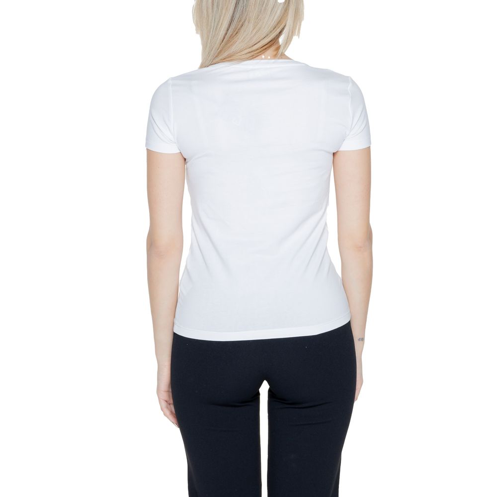 EA7 Emporio Armani white cotton top paired with dark pants for a stylish look