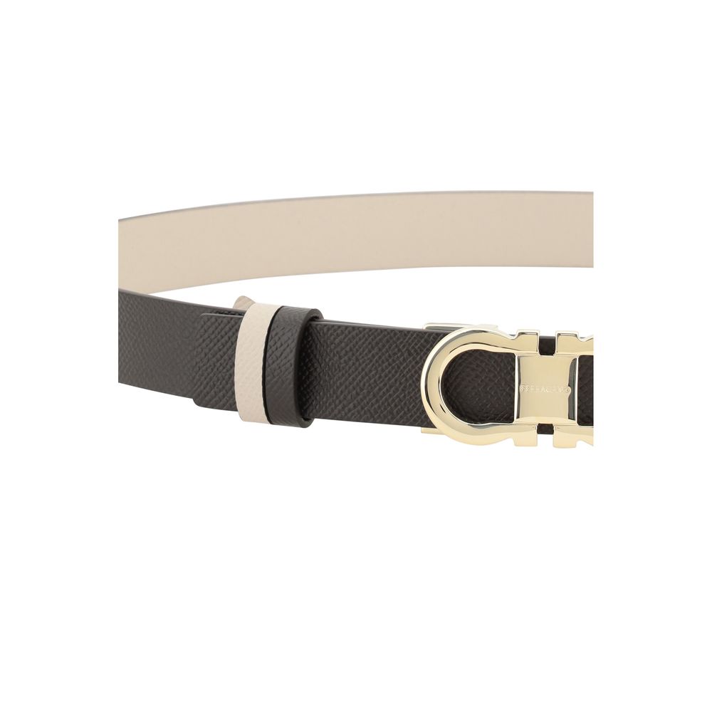 Black and beige Ferragamo reversible belt with gold buckle for stylish versatility