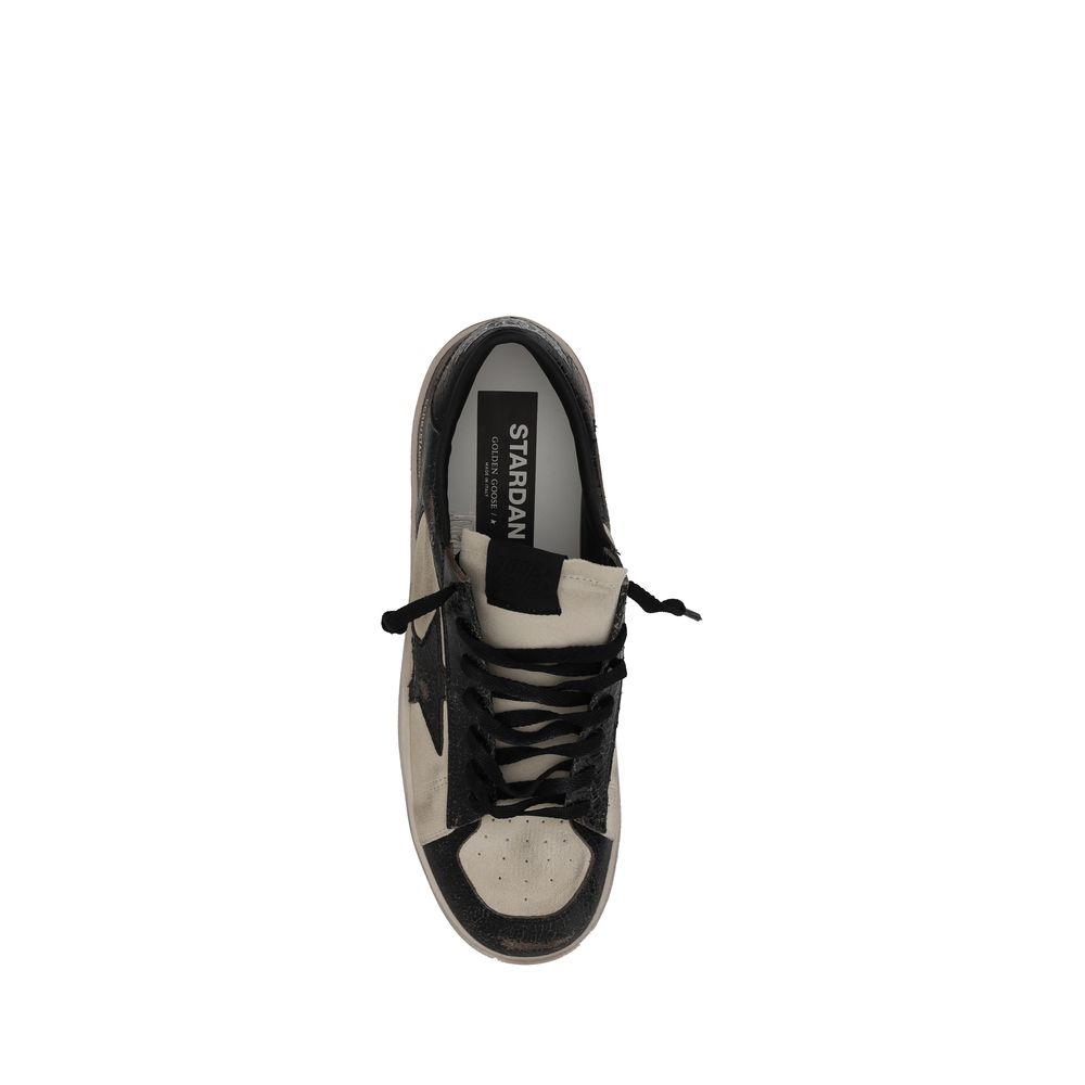 Black and white Golden Goose Stardan suede Sneakers displayed elegantly