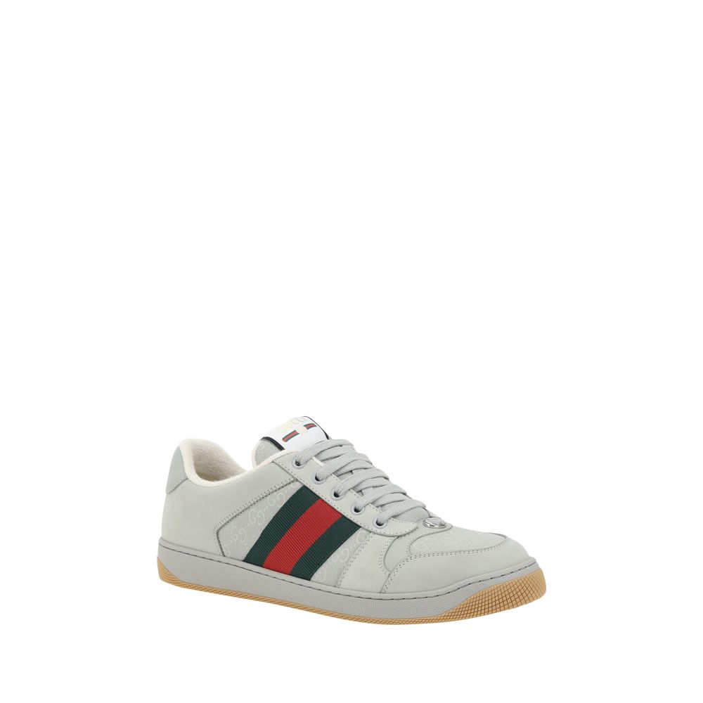 White leather Gucci Screener Sneakers featuring a green and red stripe design