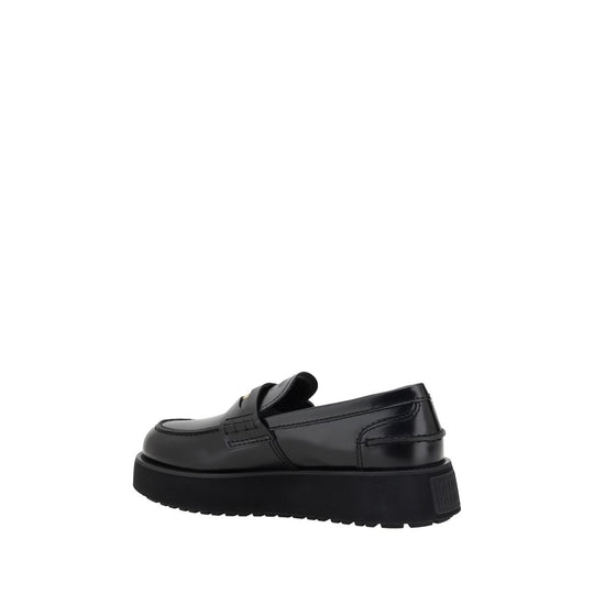 Black leather platform loafer from Miu Miu Leather Loafers collection, stylish and versatile