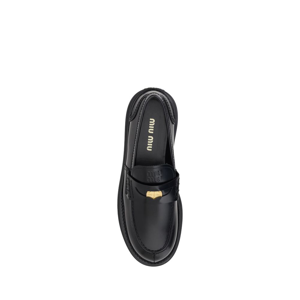 Black leather loafer from Miu Miu Leather Loafers, a stylish footwear choice