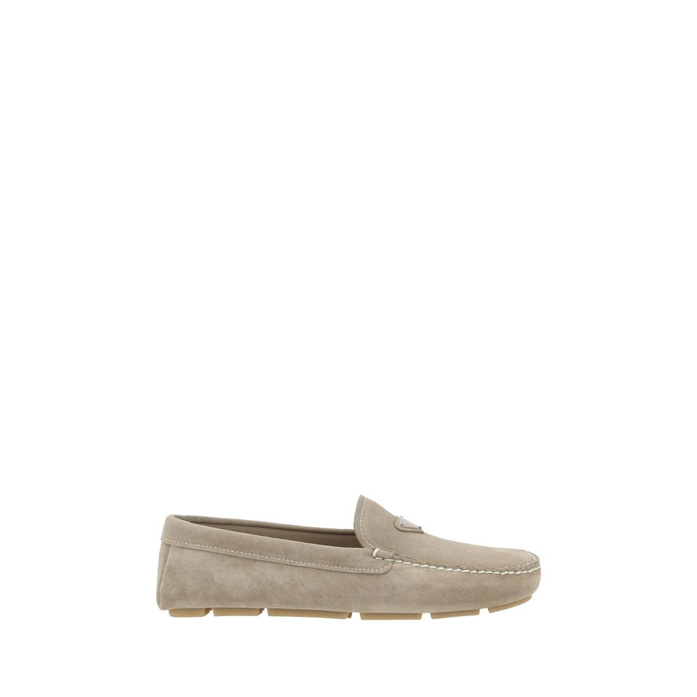 Beige suede loafers by Prada, perfect for stylish and comfortable footwear options