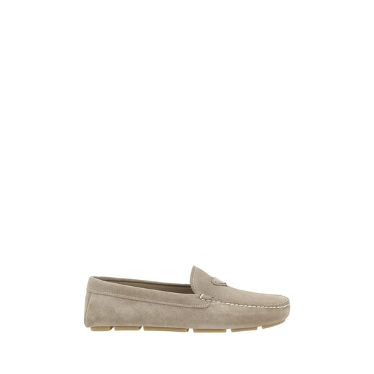 Beige suede loafers by Prada, perfect for stylish and comfortable footwear options