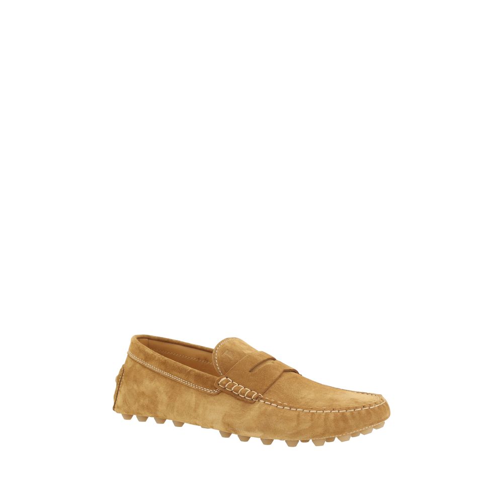 Tan suede Tod’s loafers featuring a classic penny design for stylish comfort