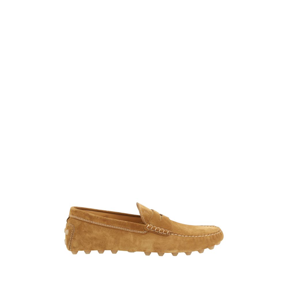 Tan suede Tod’s loafers showcasing stylish driving shoe design