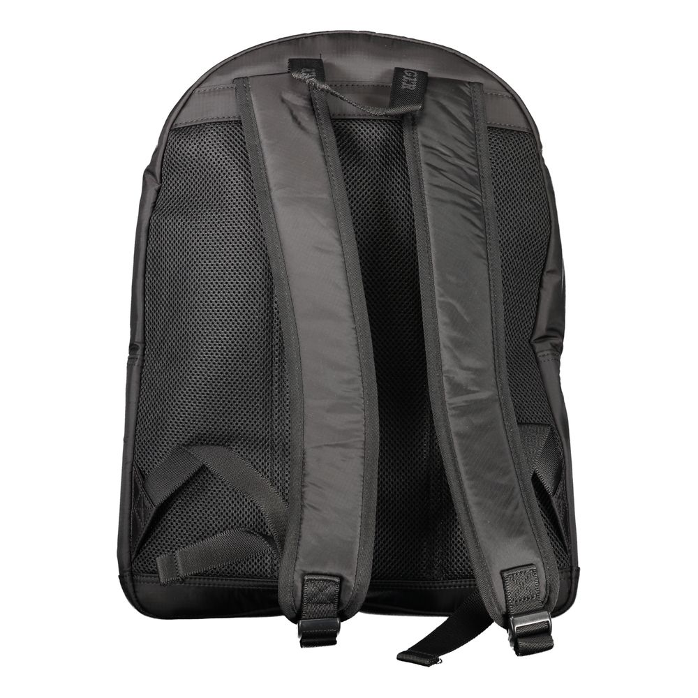 Black backpack with padded straps, featuring Tommy Hilfiger logo and durable nylon design