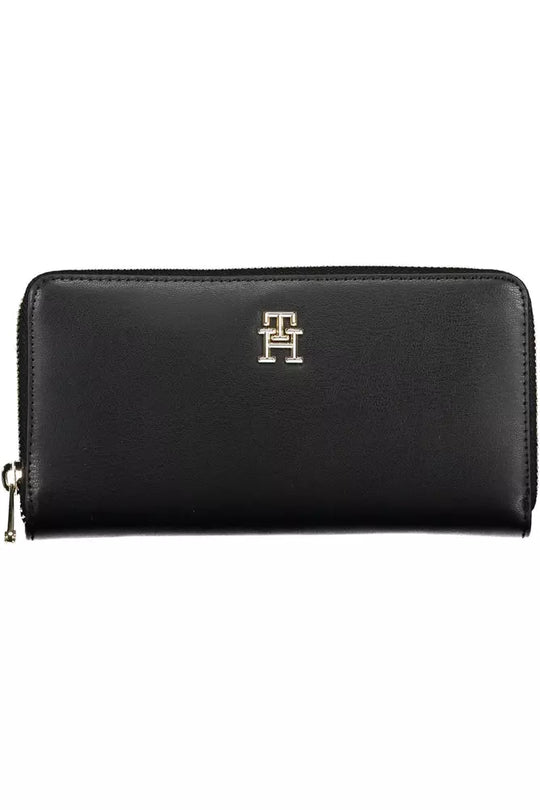 Tommy Hilfiger black wallet with zippered closure and logo detail