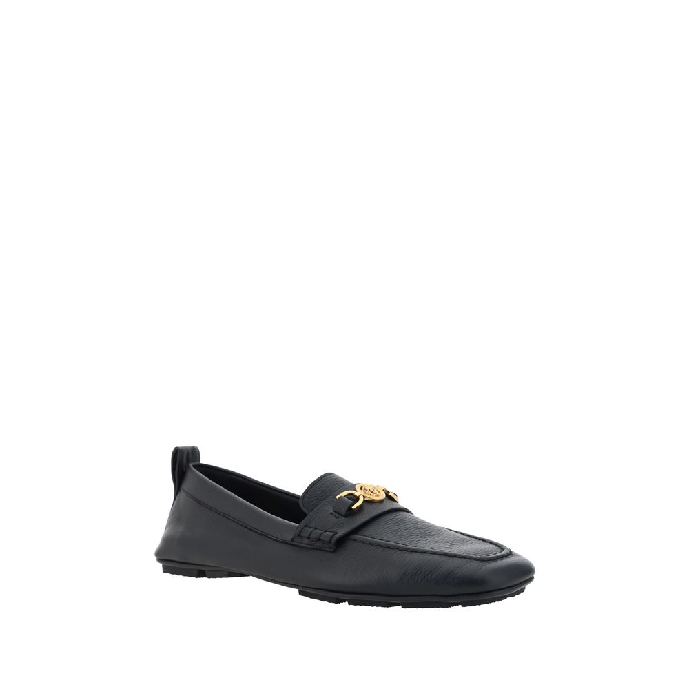 Black leather Versace Driver Loafers featuring elegant gold hardware